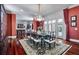 Dining room featuring hardwood floors, a chandelier, and access to the kitchen and living areas at 421 Royal Assembly Dr, Charleston, SC 29492