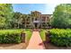 Grand two-story home with a brick pathway, manicured landscaping and inviting curb appeal at 421 Royal Assembly Dr, Charleston, SC 29492