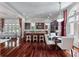 Spacious kitchen with cherry wood cabinets, granite countertops, stainless steel appliances, and a crystal chandelier at 421 Royal Assembly Dr, Charleston, SC 29492