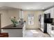 Well-lit kitchen featuring stainless steel appliances, white cabinets, and a window view at 421 Royal Assembly Dr, Charleston, SC 29492