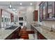 Modern kitchen with granite countertops, stainless steel appliances, and a view into the living room and dining room at 421 Royal Assembly Dr, Charleston, SC 29492