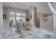 Sitting area features travertine flooring and is naturally illuminated by a large window at 421 Royal Assembly Dr, Charleston, SC 29492