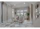 Sitting area features travertine flooring and is naturally illuminated by a large window at 421 Royal Assembly Dr, Charleston, SC 29492