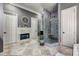 The main bathroom has a step-in shower with glass doors, a fireplace, and tile flooring at 421 Royal Assembly Dr, Charleston, SC 29492