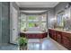 Large bathroom with soaking tub, double vanity, and updated fixtures plus a step-in shower and lots of natural light at 421 Royal Assembly Dr, Charleston, SC 29492