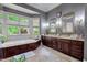 Large bathroom with soaking tub, double vanity, and updated fixtures plus a big window providing lots of natural light at 421 Royal Assembly Dr, Charleston, SC 29492