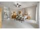 Bright main bedroom boasts neutral carpet, natural light, and ensuite bathroom at 421 Royal Assembly Dr, Charleston, SC 29492