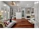 Bright and airy main bedroom with hardwood floors, a fireplace, built-in shelving, and outside access at 421 Royal Assembly Dr, Charleston, SC 29492