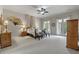 Bright main bedroom with balcony access, neutral carpet, and elegant furniture at 421 Royal Assembly Dr, Charleston, SC 29492