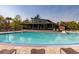 Community pool with lounge chairs and modern pool house, creating a relaxing and inviting atmosphere at 421 Royal Assembly Dr, Charleston, SC 29492