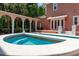 Backyard pool featuring colonnade access, awning, and lush greenery at 421 Royal Assembly Dr, Charleston, SC 29492