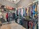 Well-organized walk-in closet with shelves and hanging rods for ample storage and organization solutions at 421 Royal Assembly Dr, Charleston, SC 29492