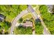 An aerial view reveals the home's prime location on a corner lot with mature trees and manicured lawn at 4403 Wild Thicket Ln, North Charleston, SC 29420
