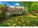 Backyard with lush greenery, featuring mature trees and well-placed shrubs to highlight the natural beauty of the property at 4403 Wild Thicket Ln, North Charleston, SC 29420