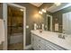 Bright bathroom with dual sinks, tiled floors, and a shower-tub combination at 4403 Wild Thicket Ln, North Charleston, SC 29420