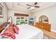 A bright, spacious main bedroom features tray ceilings and an exterior view at 4403 Wild Thicket Ln, North Charleston, SC 29420