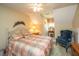 Cozy bedroom featuring an antique vanity, an armchair, and a soft quilt at 4403 Wild Thicket Ln, North Charleston, SC 29420