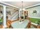 Elegant dining room featuring traditional decor, columns, and a view of the staircase at 4403 Wild Thicket Ln, North Charleston, SC 29420