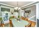 Inviting dining room with traditional decor, decorative molding and staircase view at 4403 Wild Thicket Ln, North Charleston, SC 29420
