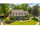 Beautiful two-story home featuring a lush green lawn and well-maintained landscaping at 4403 Wild Thicket Ln, North Charleston, SC 29420