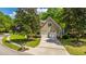 Well-maintained home featuring a two-car garage, manicured lawn, and beautiful landscaping for excellent curb appeal at 4403 Wild Thicket Ln, North Charleston, SC 29420