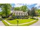 Charming home with a well-kept lawn, established landscaping, and a welcoming front porch at 4403 Wild Thicket Ln, North Charleston, SC 29420
