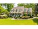 Charming home featuring a welcoming front porch and meticulously landscaped front yard at 4403 Wild Thicket Ln, North Charleston, SC 29420