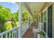 Comfortable front porch with rocking chair, offering a relaxing outdoor space and views of the neighborhood at 4403 Wild Thicket Ln, North Charleston, SC 29420