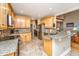 Well-equipped kitchen featuring granite countertops, stainless steel appliances, and wood cabinets at 4403 Wild Thicket Ln, North Charleston, SC 29420