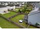 Aerial view of a fenced backyard with screened in porch, hot tub and view of neighborhood at 504 Foxbank Plantation Blvd, Moncks Corner, SC 29461