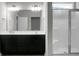 Bathroom featuring a double sink vanity and glass-enclosed shower with modern fixtures at 504 Foxbank Plantation Blvd, Moncks Corner, SC 29461