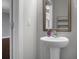 Charming powder room with pedestal sink, framed mirror, and neutral wall color at 504 Foxbank Plantation Blvd, Moncks Corner, SC 29461
