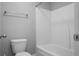 Bright bathroom featuring a shower-tub combo with white fixtures and a towel rack at 504 Foxbank Plantation Blvd, Moncks Corner, SC 29461