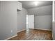 Bright bedroom featuring gray walls and wood-look flooring and a door leading to the closet at 504 Foxbank Plantation Blvd, Moncks Corner, SC 29461