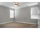 Bright bedroom with neutral walls, white trim, carpet floors, and windows providing ample natural light at 504 Foxbank Plantation Blvd, Moncks Corner, SC 29461