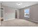 Neutral bedroom with carpet and natural light with a walk in closet and tan walls at 504 Foxbank Plantation Blvd, Moncks Corner, SC 29461