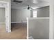 A large, empty bonus room is freshly painted in neutral colors and awaiting personal touches at 504 Foxbank Plantation Blvd, Moncks Corner, SC 29461