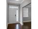 Welcoming entrance with pristine white trim, wood floors, and lots of natural light at 504 Foxbank Plantation Blvd, Moncks Corner, SC 29461