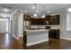 Open concept kitchen with island, granite countertops, and stainless steel appliances at 504 Foxbank Plantation Blvd, Moncks Corner, SC 29461