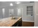 Open concept kitchen with granite countertops, stainless steel sink, and view of a laundry area at 504 Foxbank Plantation Blvd, Moncks Corner, SC 29461
