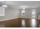 Bright and open living room featuring hardwood floors, natural light, and neutral color scheme at 504 Foxbank Plantation Blvd, Moncks Corner, SC 29461
