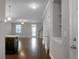 Open concept living space featuring gorgeous floors, neutral paint, and an adjacent kitchen at 504 Foxbank Plantation Blvd, Moncks Corner, SC 29461