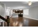 Open floor plan with beautiful floors, showcasing kitchen, dining, and living areas at 504 Foxbank Plantation Blvd, Moncks Corner, SC 29461