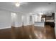 Spacious living area features dark wood floors and an open layout, perfect for entertaining at 504 Foxbank Plantation Blvd, Moncks Corner, SC 29461
