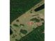 Sprawling estate featuring a private pond, lush landscaping, and a serene country setting at 6935 Hickorynut Ln, Ravenel, SC 29470