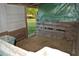 Simple barn interior with hay bedding and wooden pallet walls at 6935 Hickorynut Ln, Ravenel, SC 29470