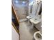 Bathroom featuring double sinks, tiled flooring, and a tiled shower with a glass door at 6935 Hickorynut Ln, Ravenel, SC 29470