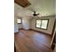 Bedroom with hardwood floors, neutral walls, natural light from windows, and a ceiling fan at 6935 Hickorynut Ln, Ravenel, SC 29470