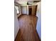 Bright bedroom featuring hardwood flooring, neutral walls, and plenty of natural light at 6935 Hickorynut Ln, Ravenel, SC 29470