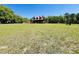 Charming home on expansive lawn surrounded by mature trees at 6935 Hickorynut Ln, Ravenel, SC 29470